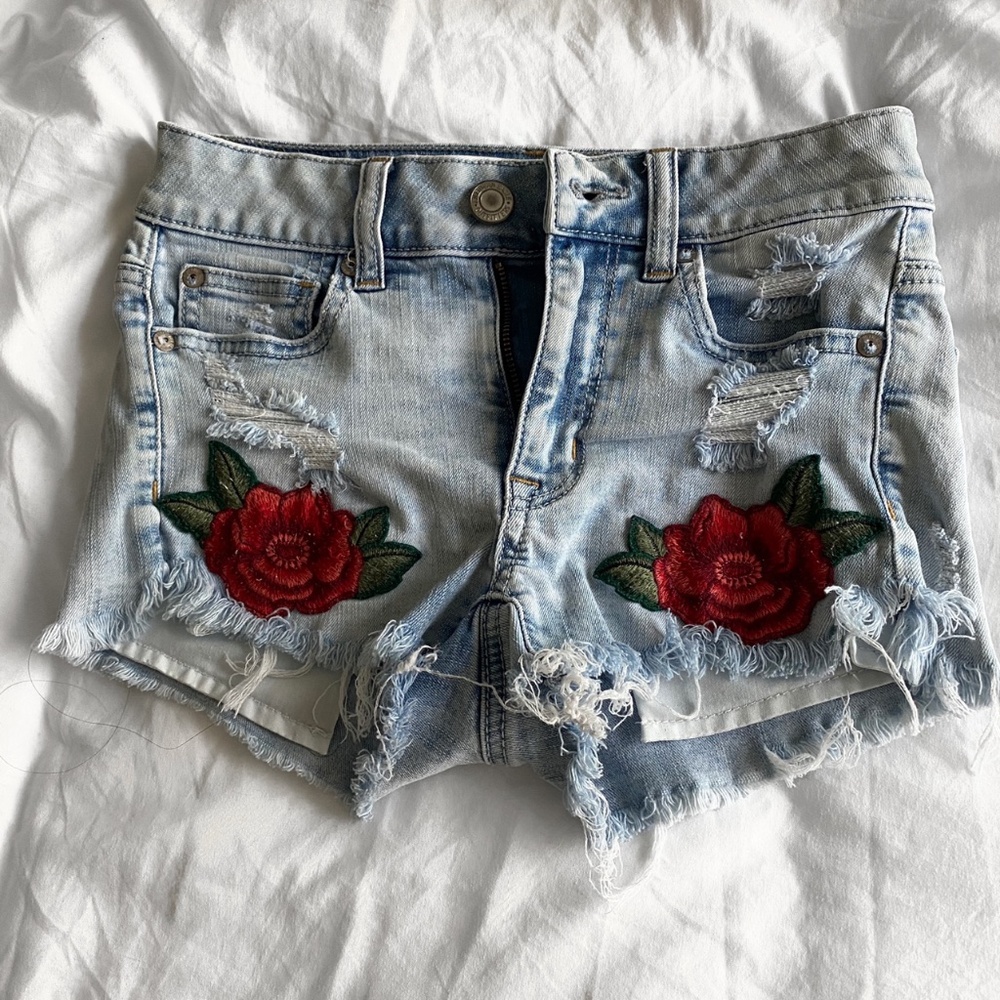 Denim shorts with floral appliqué